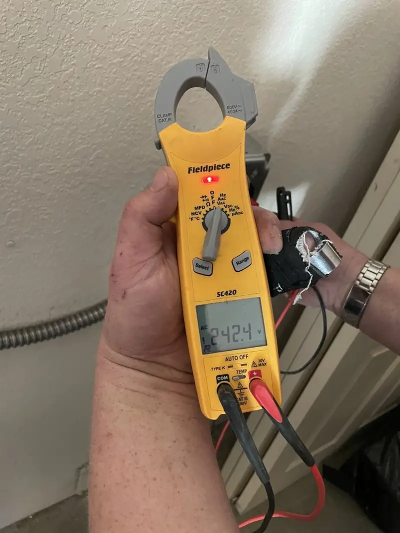 Voltage testing with clamp meter during Ceiling Fan Installation in Silverdale